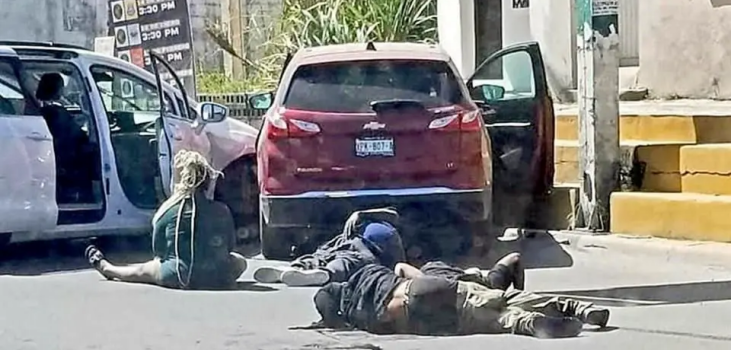 Image of crashed cars and people lying on the street injured and dead